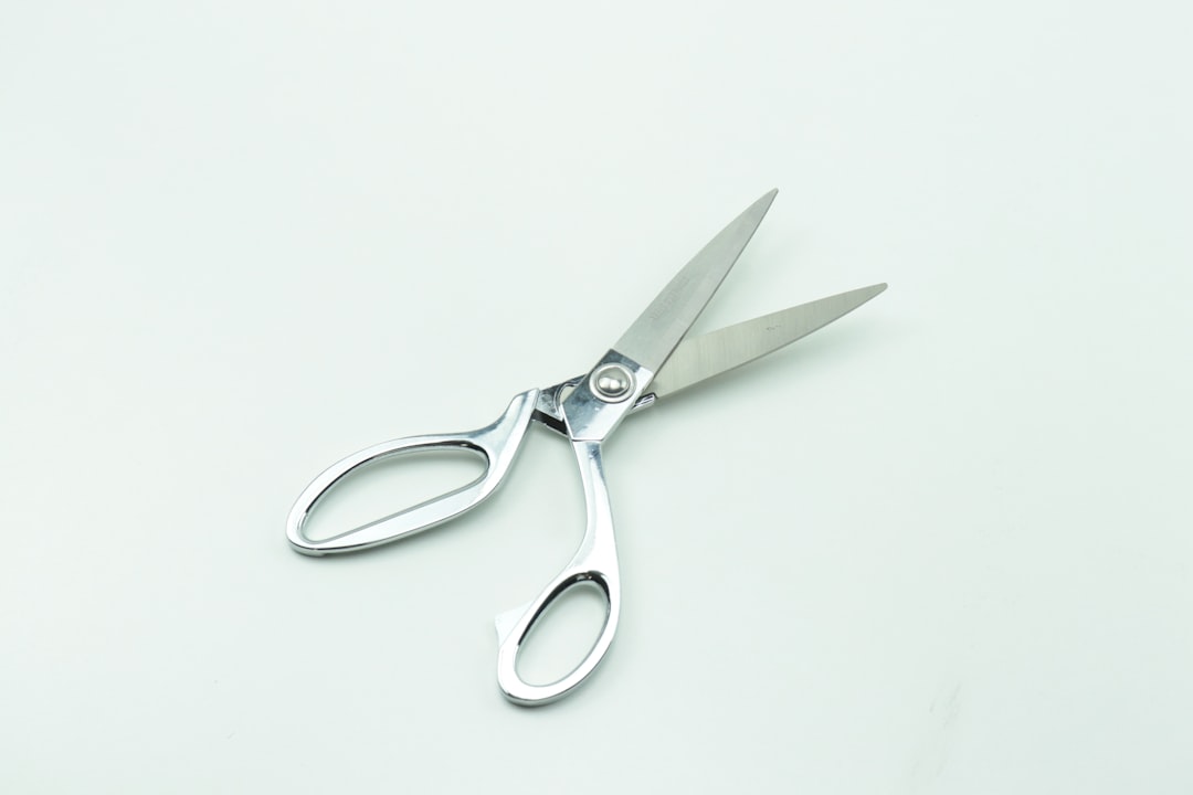 a pair of scissors sitting on top of a table